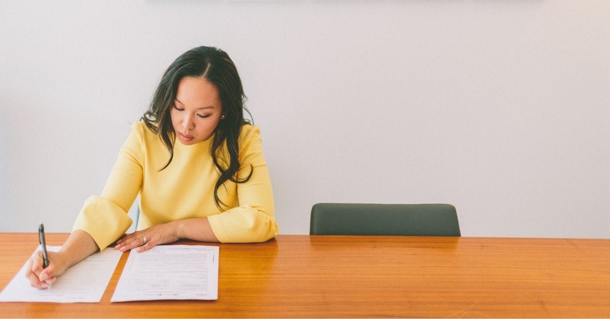 how to make job interviews matter, woman in yellow shirt prepares for job interview