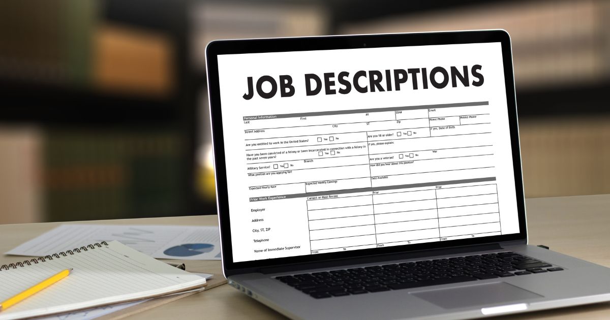 laptop with the words job descriptions to describe how to write effective job descriptions