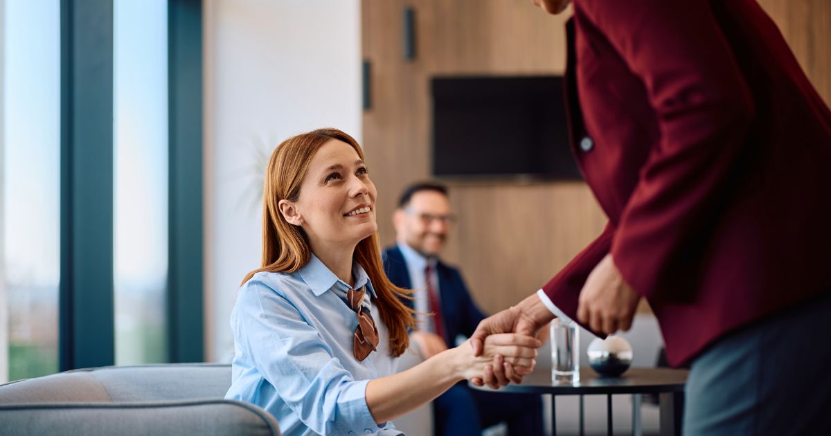two women shaking hands
